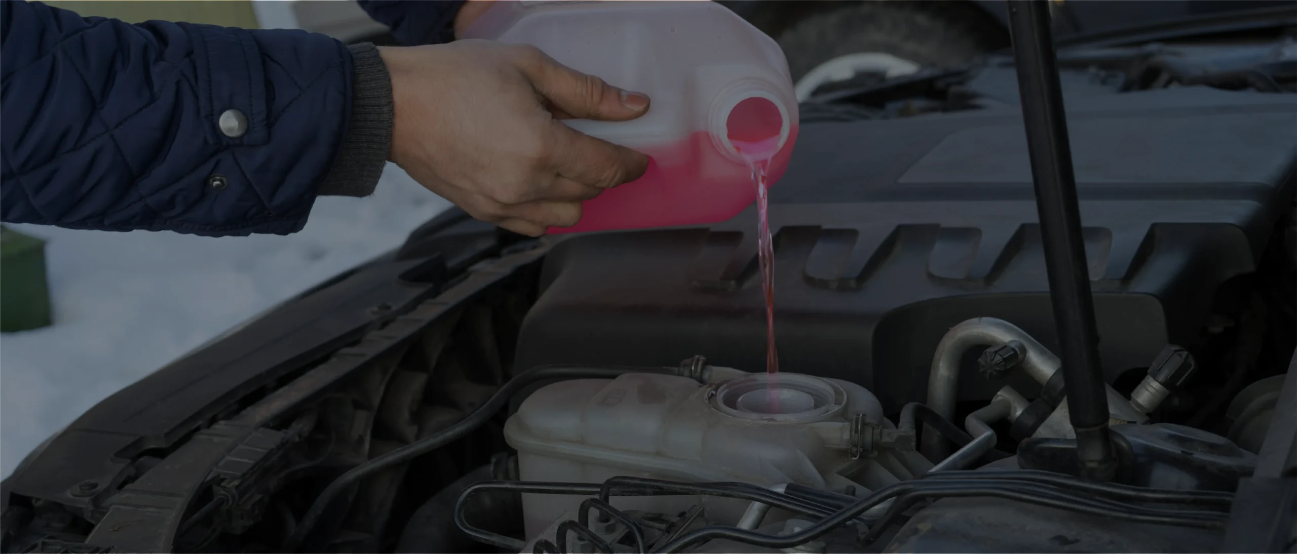 Mechanic refilling fluids in vehicle - Car Fluid Services in Chicago