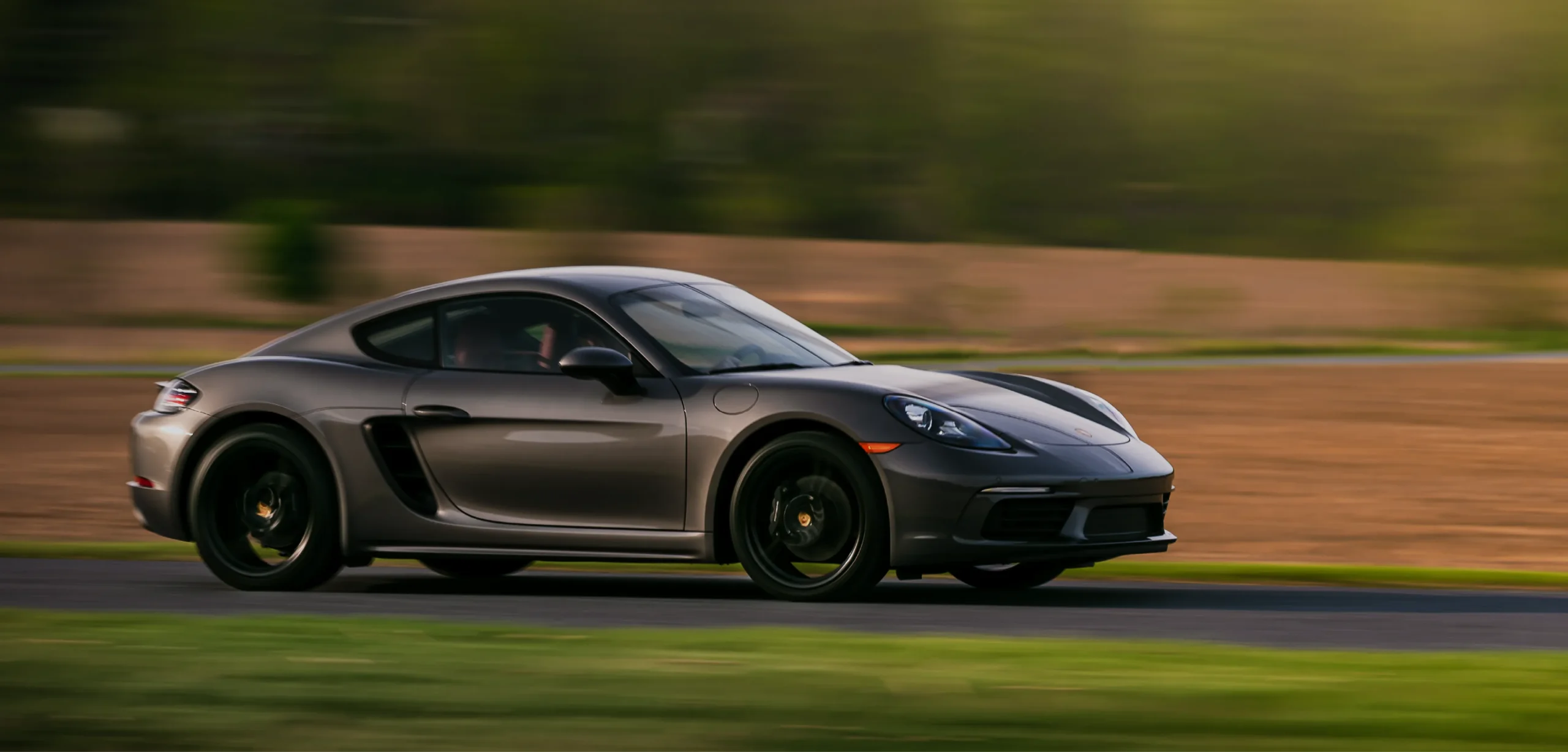 Gray Porsche Driving